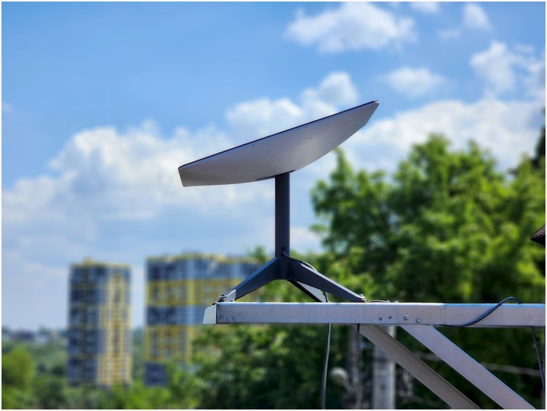 a white surfboard sitting on top of a metal pole
