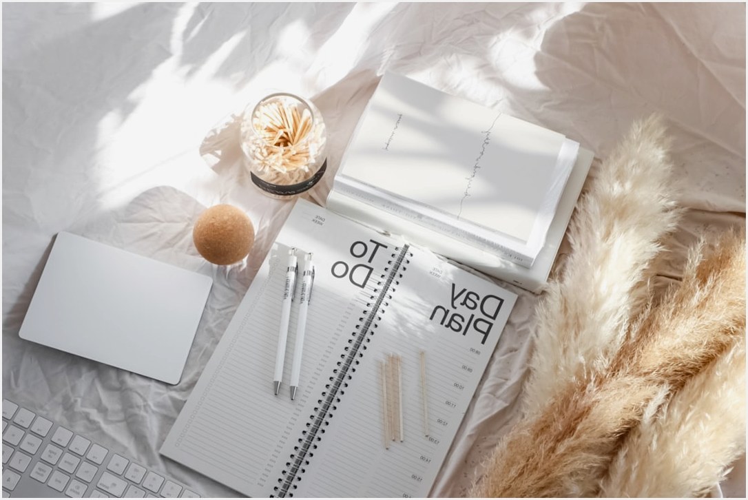 white pen on white notebook