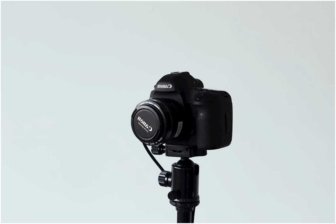 black canon dslr camera on white background